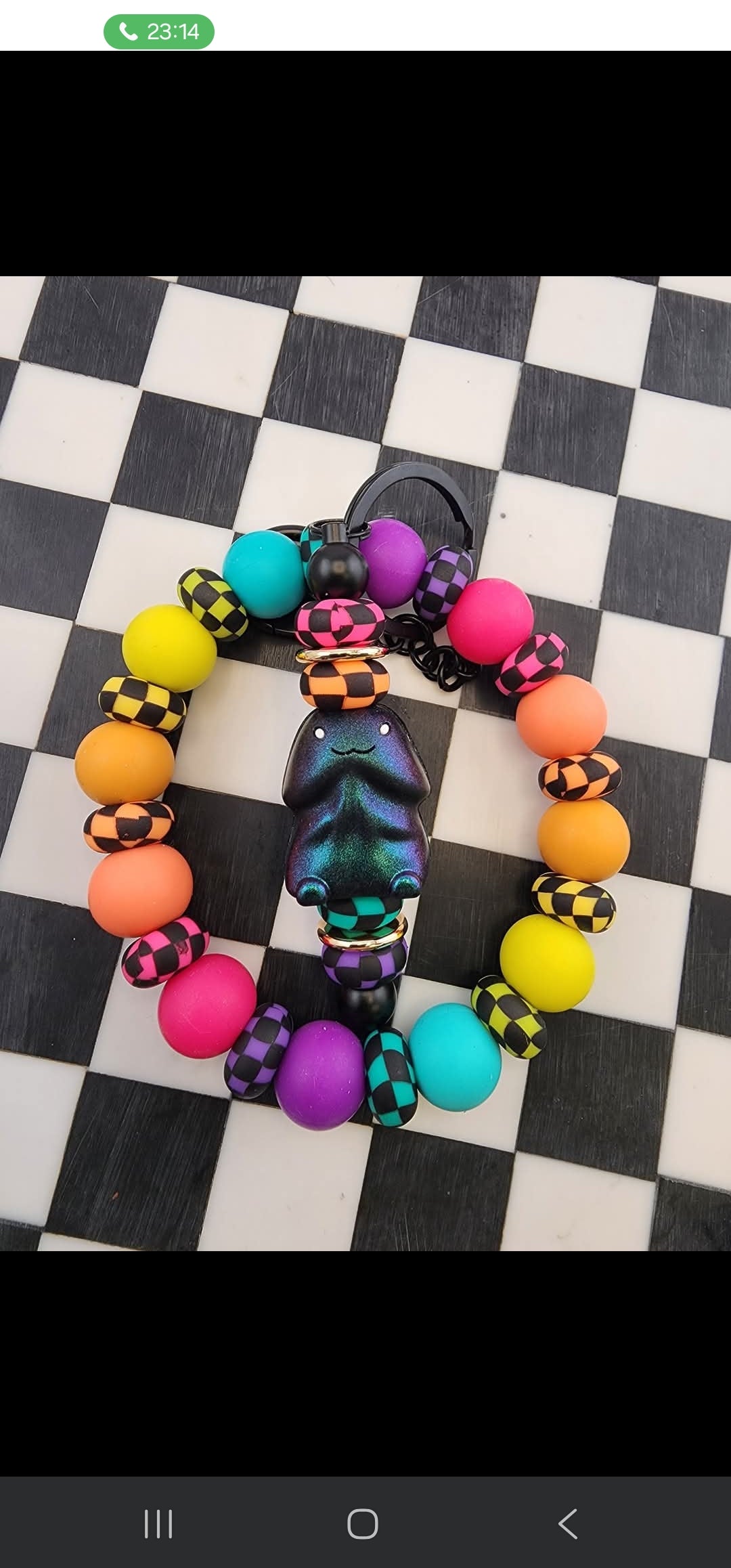Oil slick richard rainbow lentil wristlet
