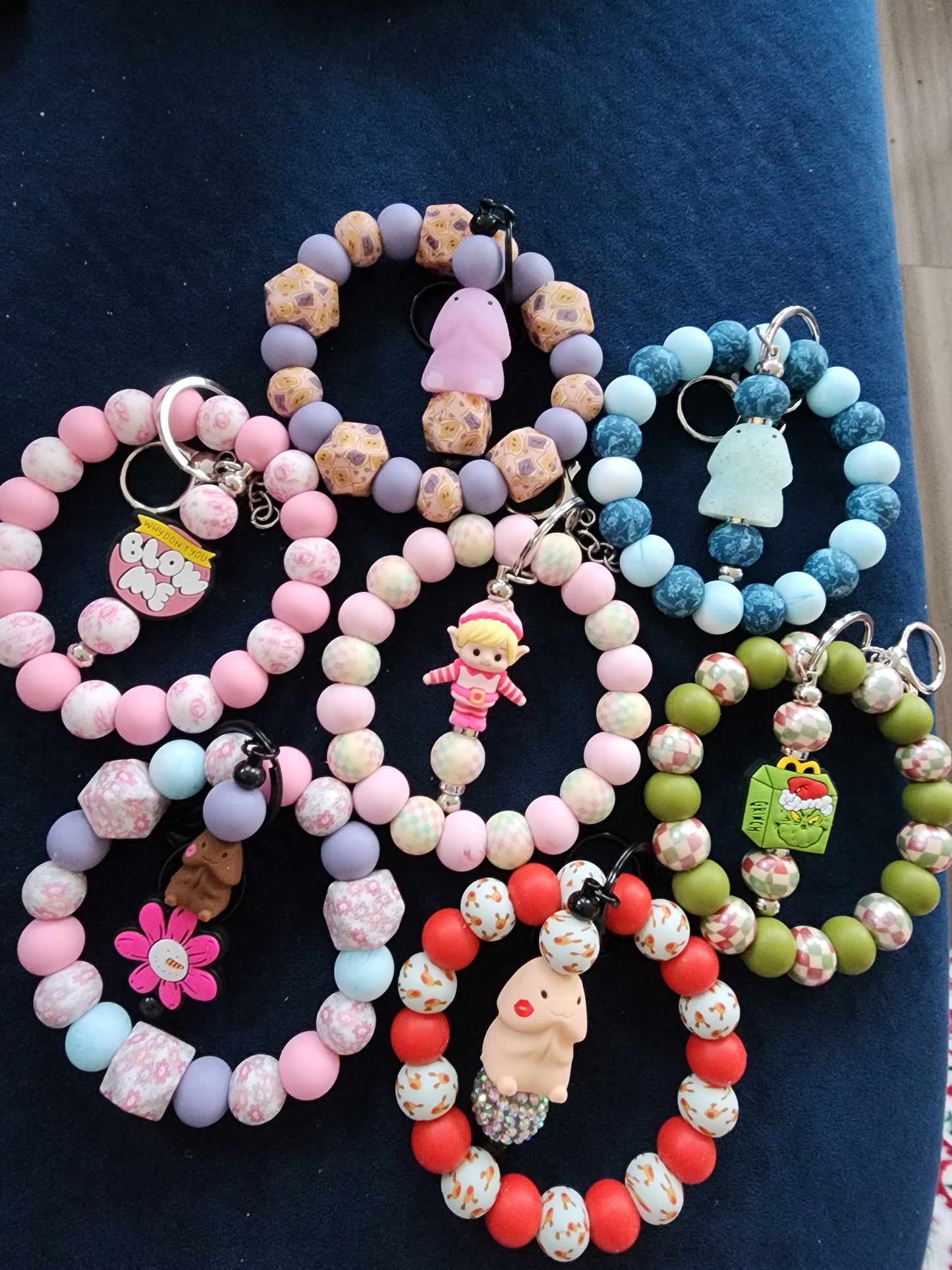 Green guy and pink elf silicone wristlet keys